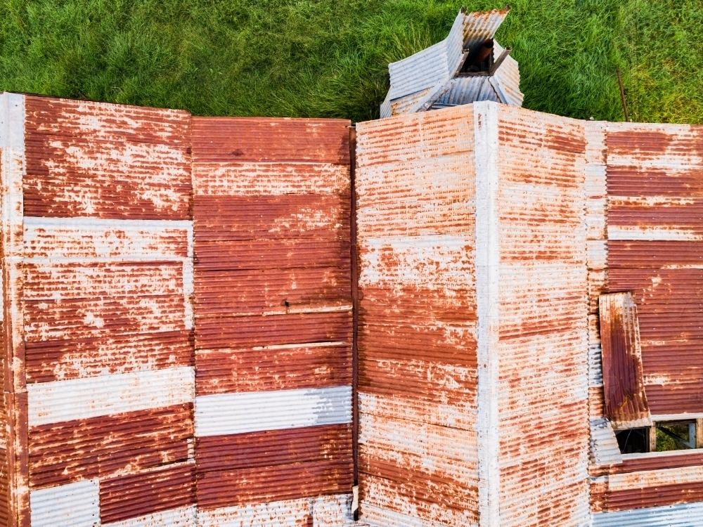Textured rusty metal corrugated iron roof of building - Australian Stock Image