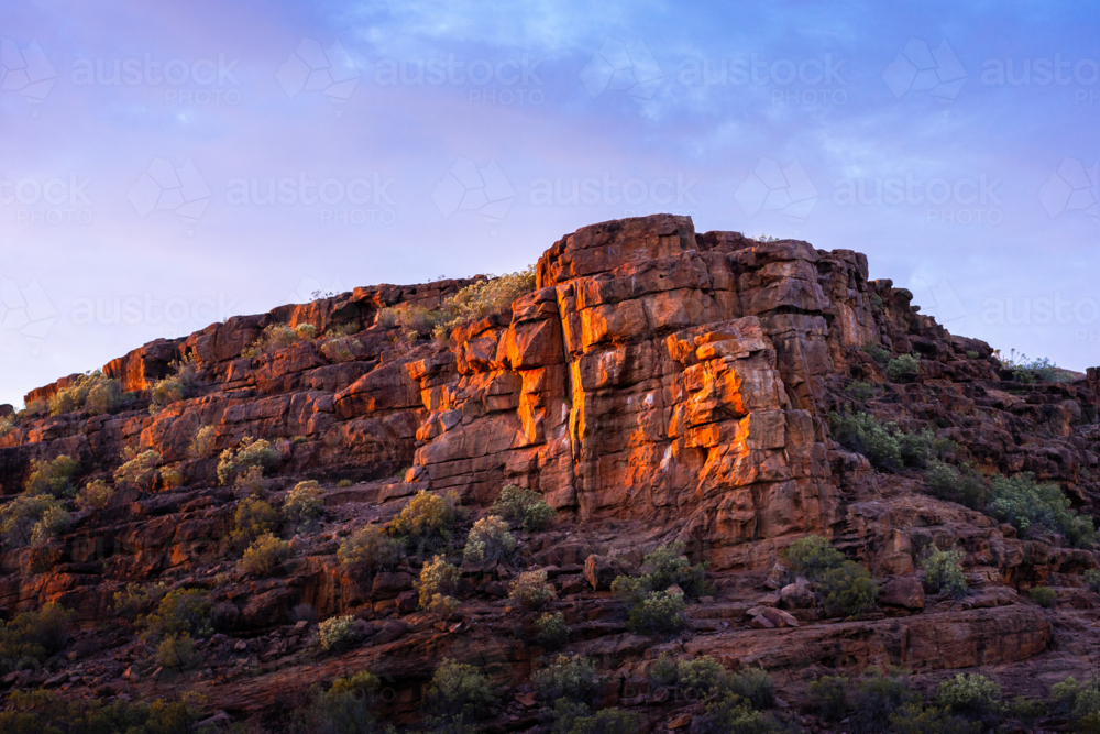 The Arid rocky cliff face in Outback Australia - Australian Stock Image