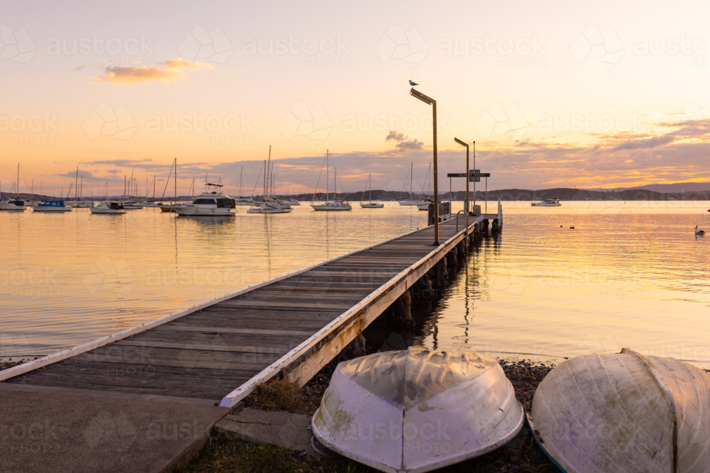 The Belmont Jetty on Lake Macquarie at sunset - Australian Stock Image
