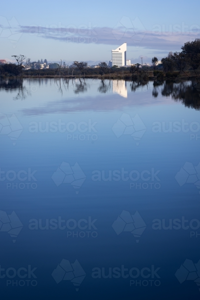 the bunbury tower on the skyline above still blue water of the inlet - Australian Stock Image