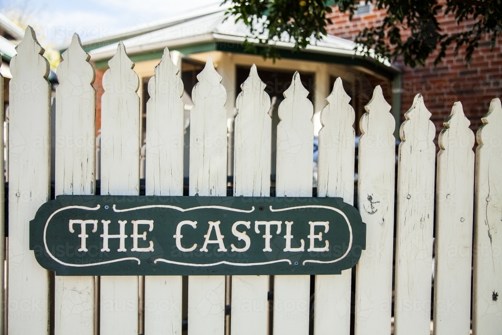 Image of The Castle sign on a white fence - Austockphoto