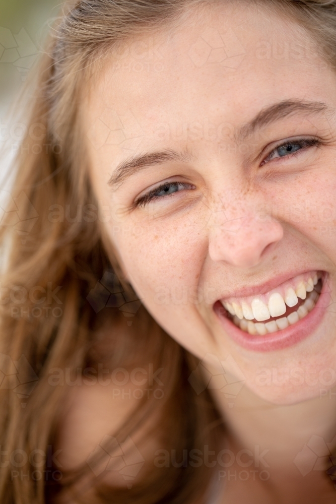 The face of a laughing teenage girl - Australian Stock Image