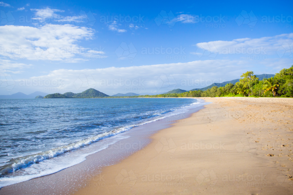 The famous idyllic beachfront of Palm Cove on a winter's day in Queensland, Australia - Australian Stock Image