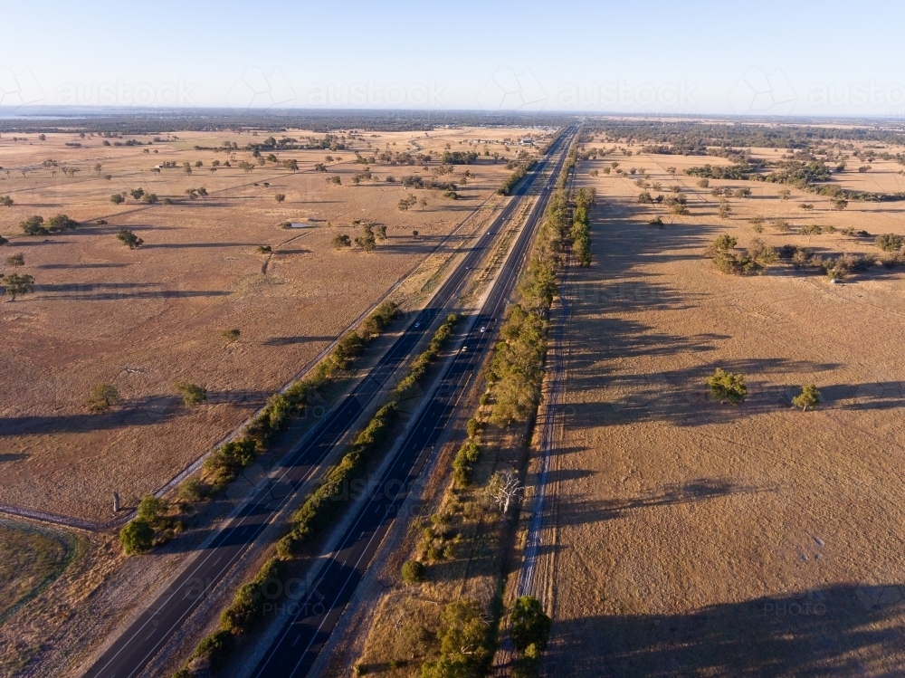 The Forrest Highway cutting through farmland in the Peel Region - Australian Stock Image