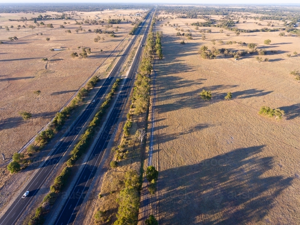 The Forrest Highway cutting through farmland in the Peel Region - Australian Stock Image