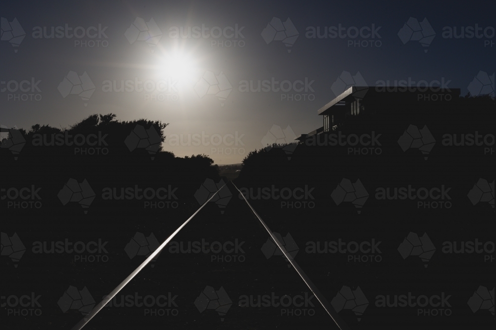 The glowing track heading towards sunset - Australian Stock Image