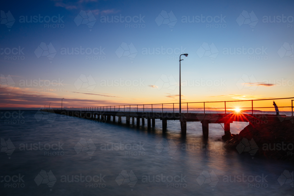 The iconic Rye Pier on a cool winter's morning at sunrise on the Mornington Peninsula in Melbourne, - Australian Stock Image