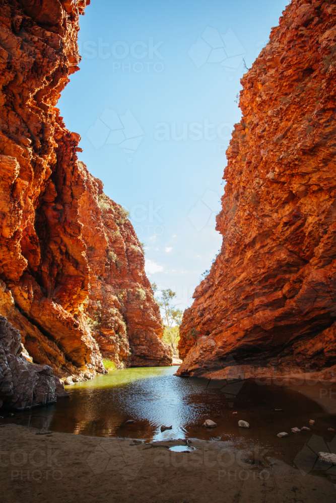The iconic Simpsons Gap and its orange rock formations in MacDonnell Ranges National Park - Australian Stock Image