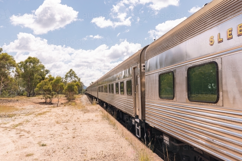 The iconic 'Southern Aurora' passenger train stopped at remote Ben Bullen Station - Australian Stock Image