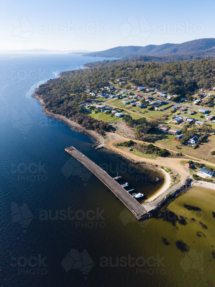 The jetty area along the beach in front of Allonnah, Bruny Island - Australian Stock Image