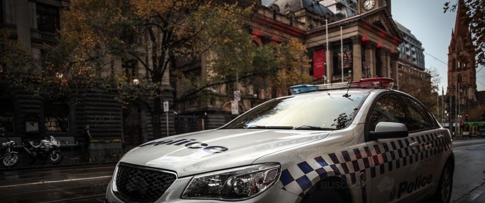 The Melbourne CBD at dawn - police car outside the town hall - Australian Stock Image