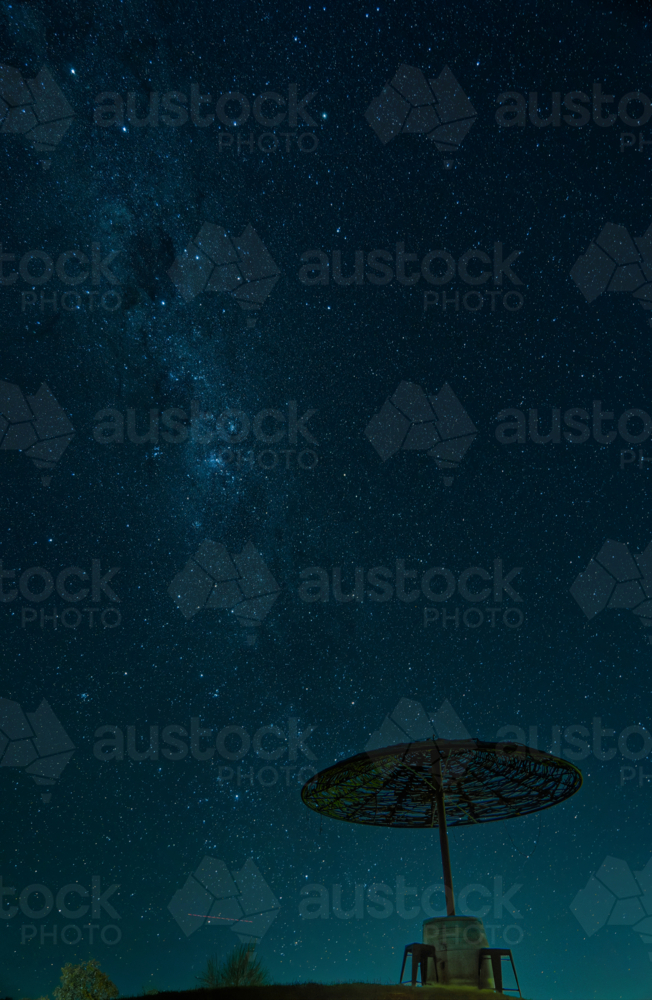 The Milky Way Galaxy Visible in the Night Sky Above a Silhouetted Shelter - Australian Stock Image
