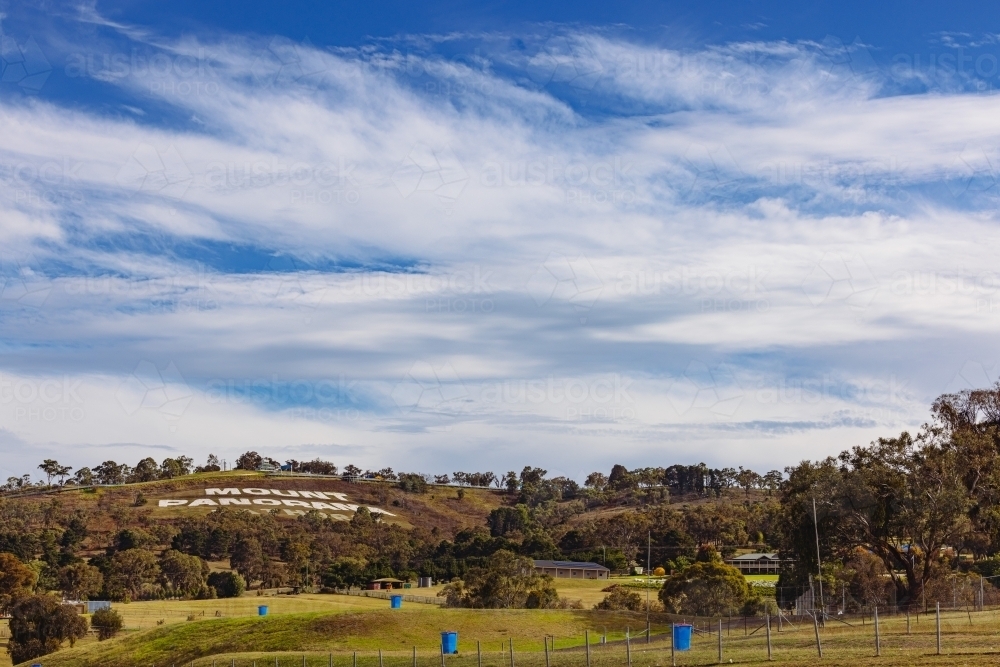 The Mount Panorama racing circuit sign at Bathurst NSW seen from distance - Australian Stock Image