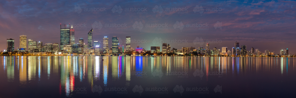 The Perth city skyline and reflection in the swan river at night - Australian Stock Image