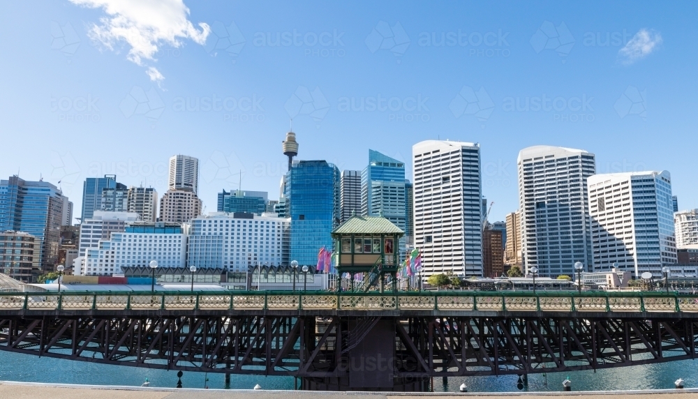 The Pyrmont Bridge when open to tall vessels, Cockle Bay. Sydney skyline in the background - Australian Stock Image