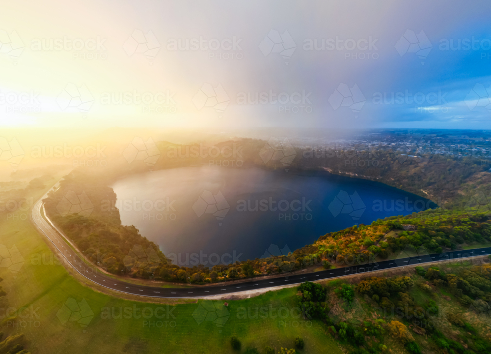 The rural town of Mt Gambier and its famous Blue Lake crater on a stormy autumn day. - Australian Stock Image