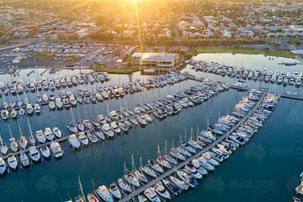 The sun rising over the city and a marina in Fremantle, Western Australia - Australian Stock Image