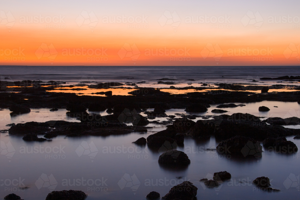 The sun sets at East Point on a summer's evening in Darwin, Northern Territory, Australia - Australian Stock Image