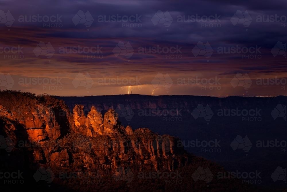 The Three Sisters at night with lightning bolts - Australian Stock Image