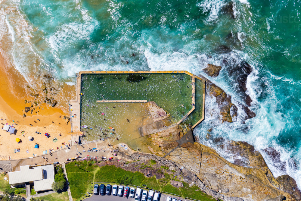 The tidal rockpool at the southern end of Curl Beach. - Australian Stock Image