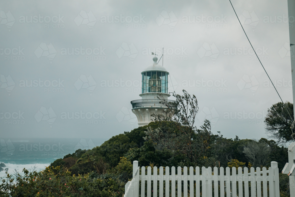 The tip of Sugarloaf Point Lighthouse on the clifftop at Seal Rocks - Australian Stock Image