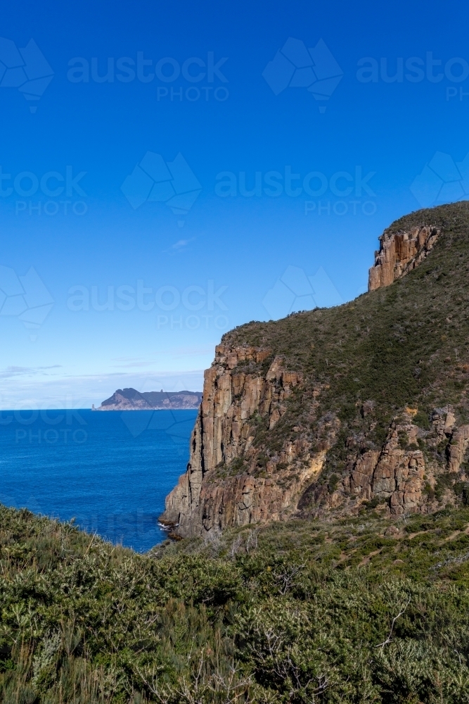 The view from Tasmania's Cape Hauy on the Three Capes Track towards Tasman Island - Australian Stock Image