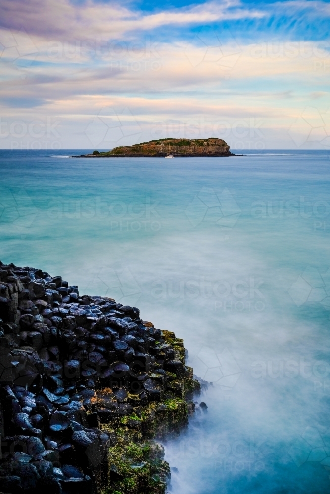 The view out to sea from Fingal Head showing the hexagonal rocks - Australian Stock Image