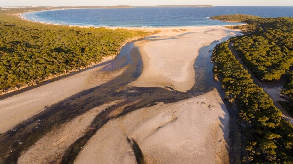 The Wellstead estuary and sand bar to the sea at Bremer Bay - Australian Stock Image