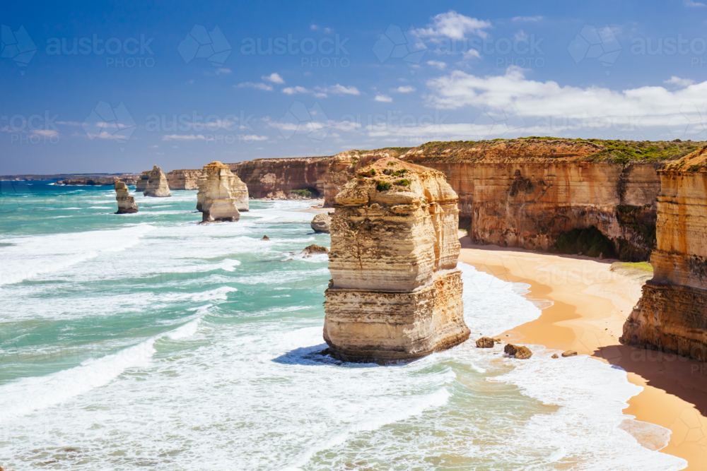 The world famous 12 Apostles on a bright sunny day along the Great Ocean Rd near Port Campbell - Australian Stock Image