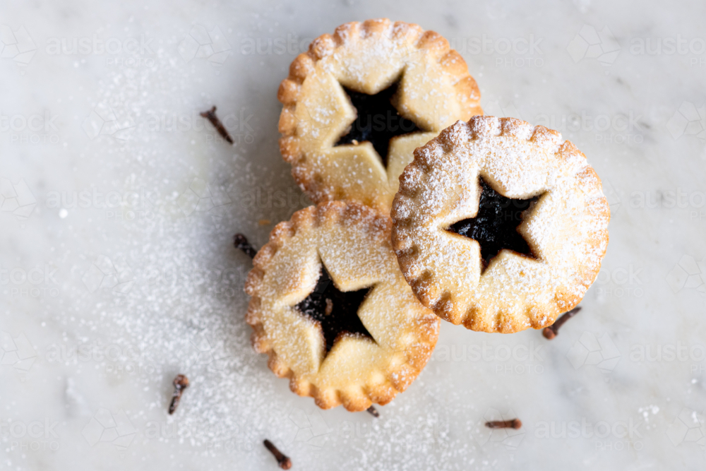 Image of three baked fruit mince pies, a traditional christmas food ...