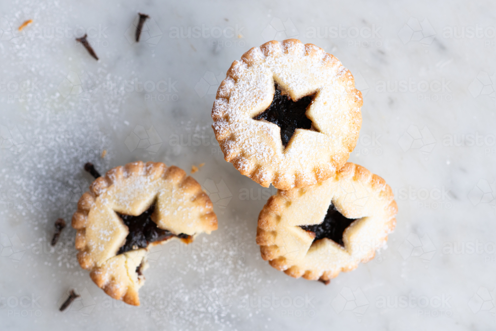 three baked fruit mince pies, a traditional christmas food - Australian Stock Image