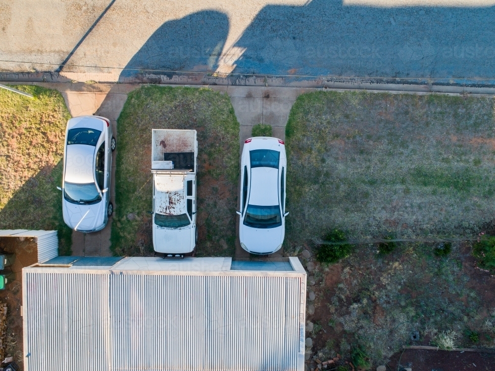 Three cars parked outside of shed - Australian Stock Image