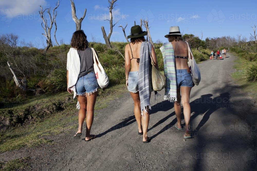 Three girls walking up a pathway - Australian Stock Image