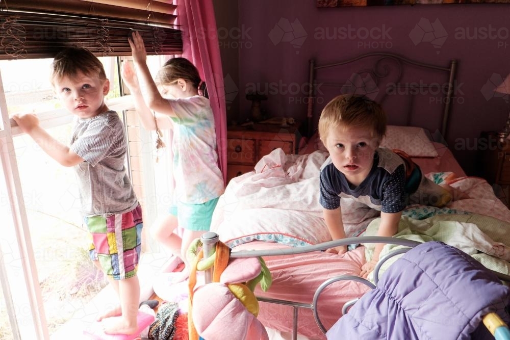 Three Kids in a Bedroom - Australian Stock Image