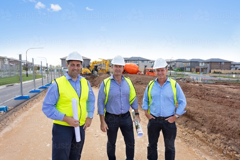 Three property developers together on-site - Australian Stock Image