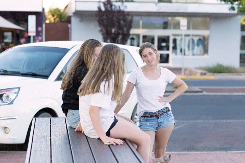 Three teenage girls hanging out in the street - Australian Stock Image