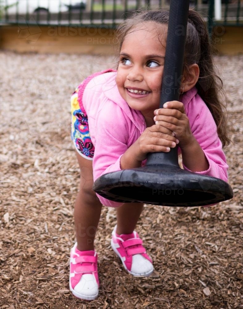 Three Year Old Aboriginal Girl in Playground - Australian Stock Image