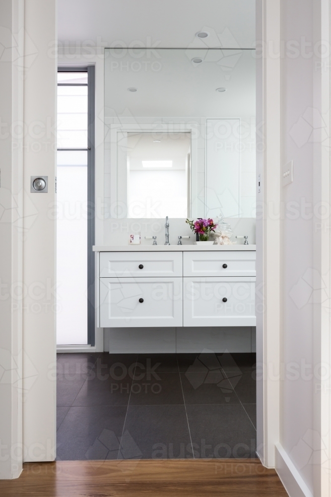 Through the door to a luxury bathroom vanity - Australian Stock Image