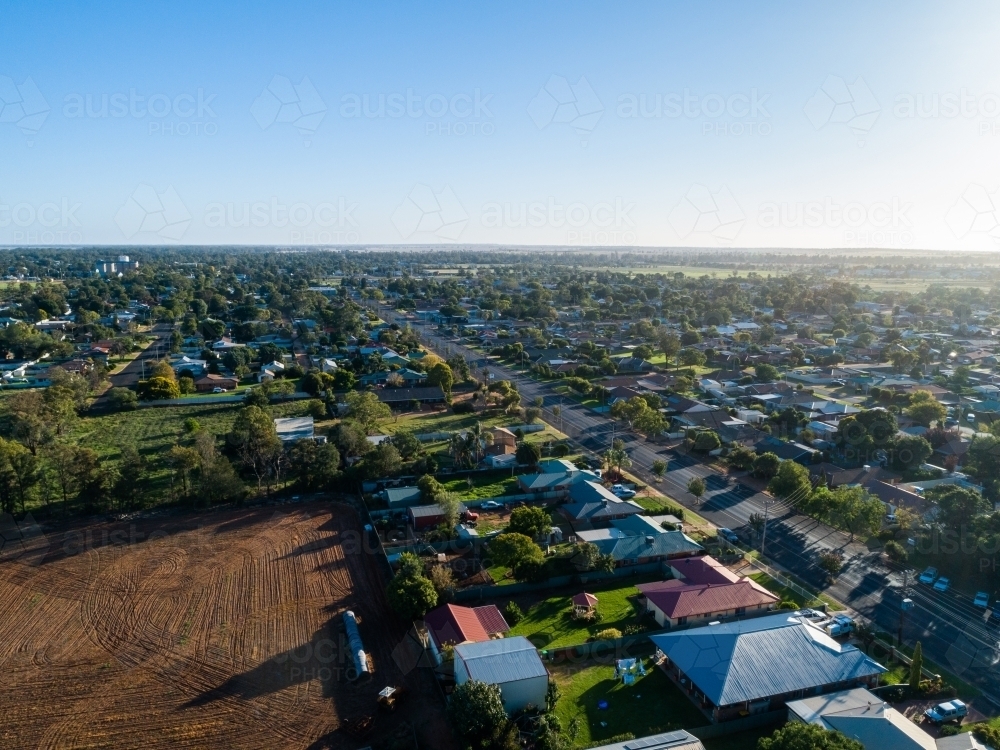 Tilled farm paddock at the edge of small country town of Narromine - Australian Stock Image