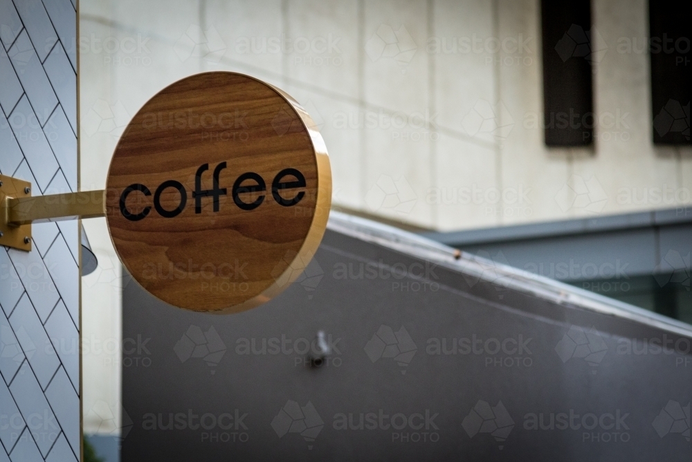 Timber coffee sign on city street - Australian Stock Image