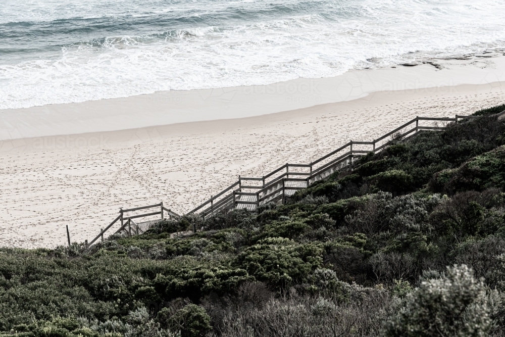timber stairs leading to beach in the seascape - Australian Stock Image