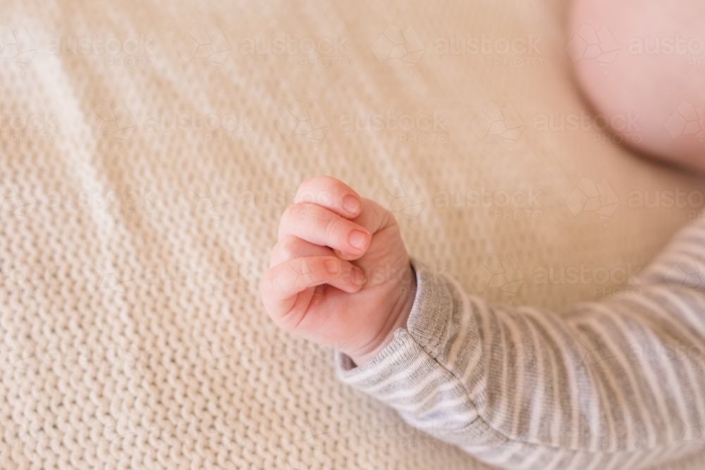 Tiny hand grasp baby boy - Australian Stock Image