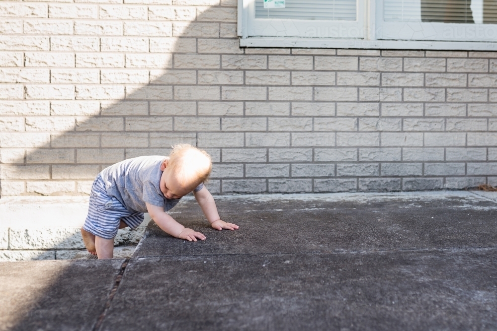 Toddler mastering the steps - Australian Stock Image