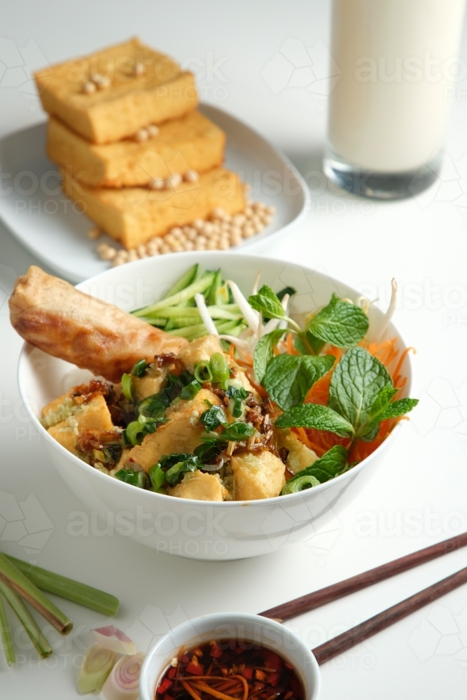 Tofu Bun Cha Gio bowl with topped with fried spring roll. - Australian Stock Image
