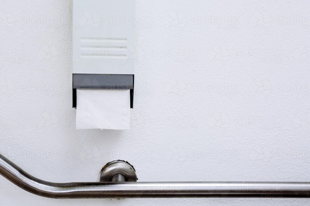 Toilet paper dispenser In outdoor public toilet - Australian Stock Image