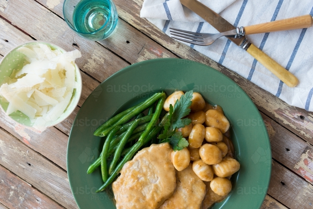 Top down of chicken and pasta dish with green beans - Australian Stock Image