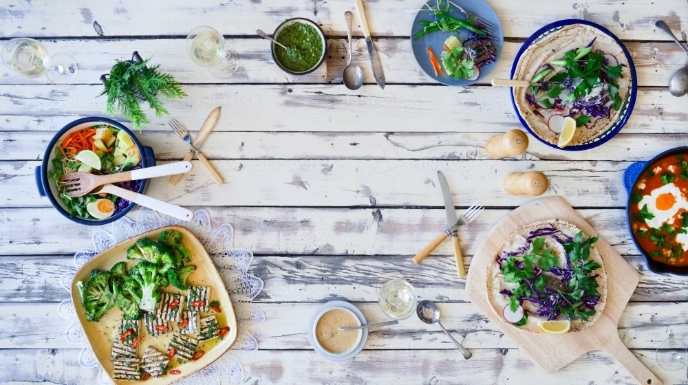 Top down of table set with healthy dishes - Australian Stock Image