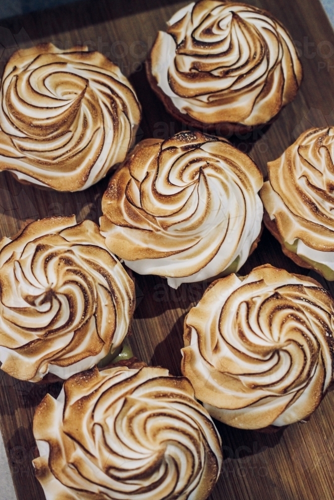 Top down shot of meringue tarts after they have been blowtorched - Australian Stock Image