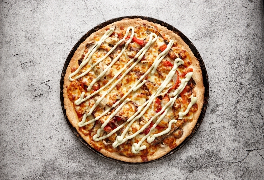 top shot of a mediterranean lamb pizza : Austockphoto top shot of a mediterranean lamb pizza - Australian Stock Image