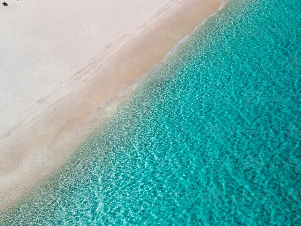 top shot of a white sand beach on a sunny day - Australian Stock Image